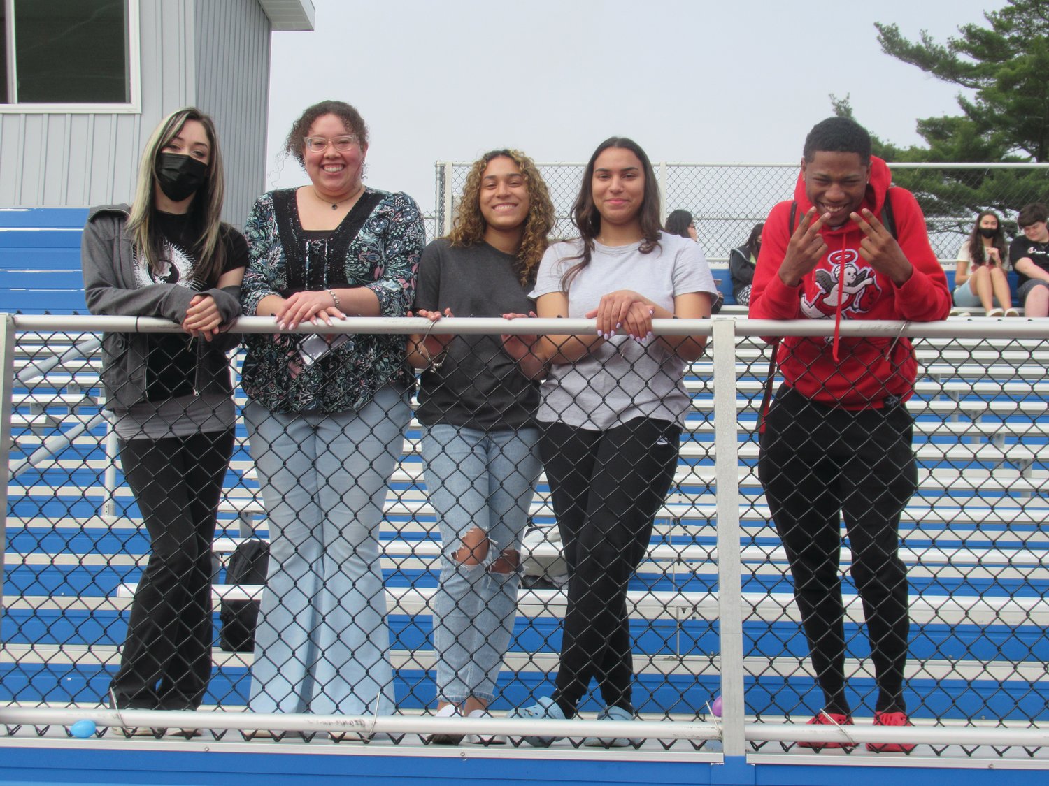 WATCHING THE HUNT: Isabella Ribezzo, Glorianna Crichlow, Jennell Fernandez, Gezzelie Fernandez and Xavier Thomas were among the JHS students who paid $1 to sit in the bleachers to watch last week’s Easter Hunt.